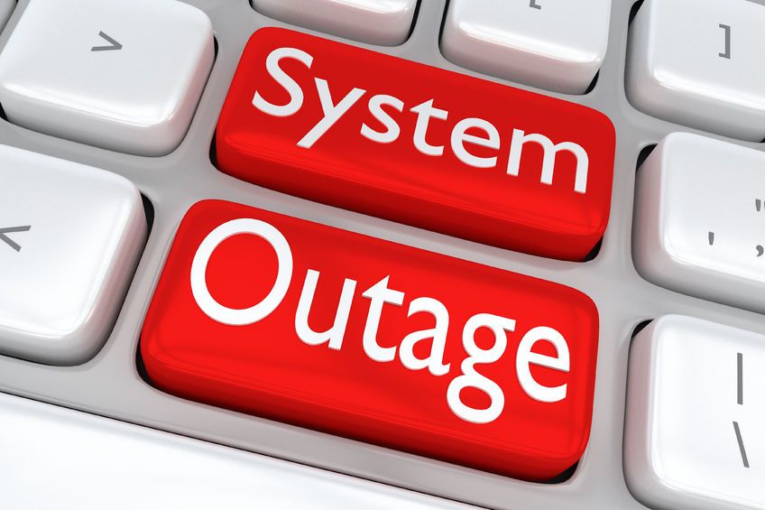 Image of a keyboard with words System Outage