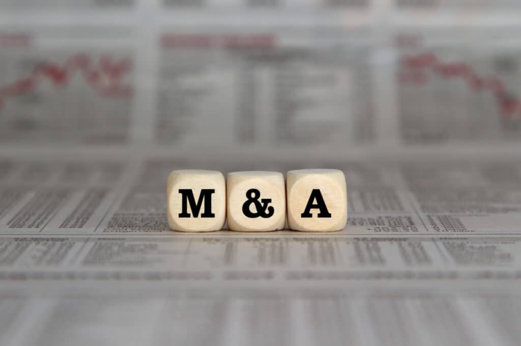 Image of dice spelling out M&A