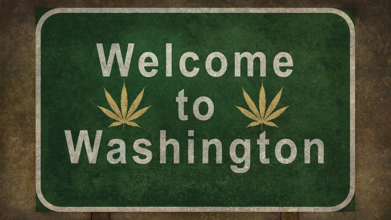 Image of a Welcome to Washington sign bearing cannabis leaves