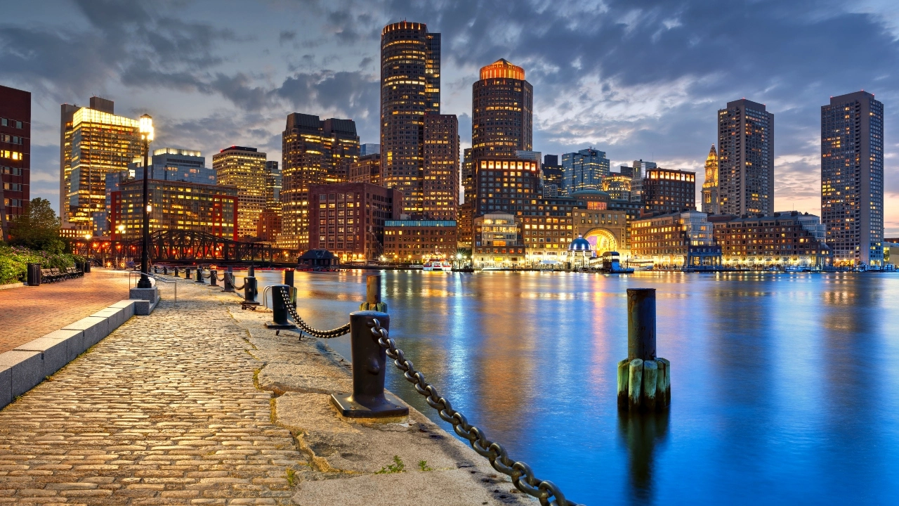 Image of downtown Boston skyline at night 