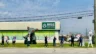 Image of workers striking outside a Rise Dispensary