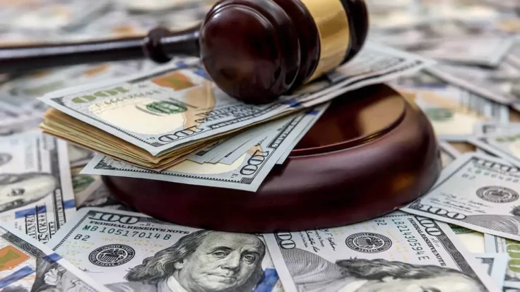 Image of a gavel surrounded by cash