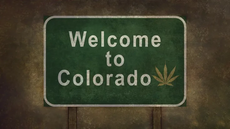 Image of Welcome to Colorado sign with cannabis leaf