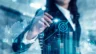 Image of a businesswoman analyzing and calculating data for business strategies.