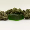 Image of a delta-8 gummy surrounded by hemp flower