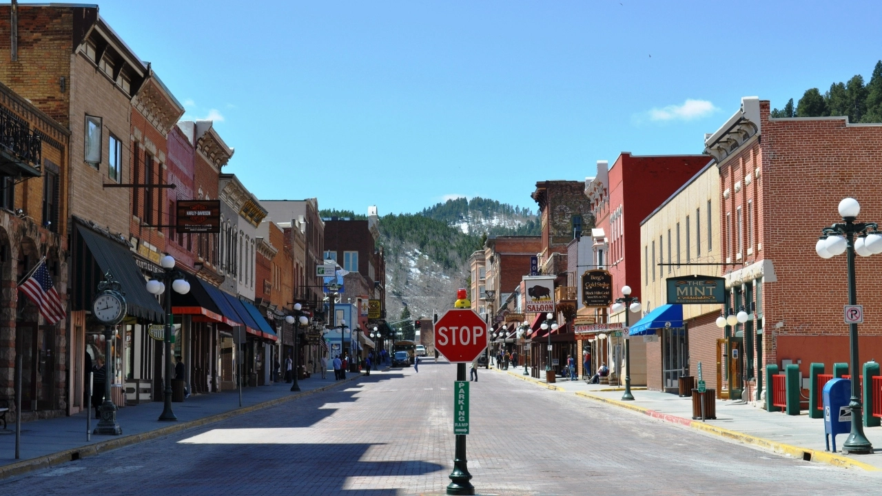 Image of downtown Deadwood, South Dakota with a stop sign in the foreground