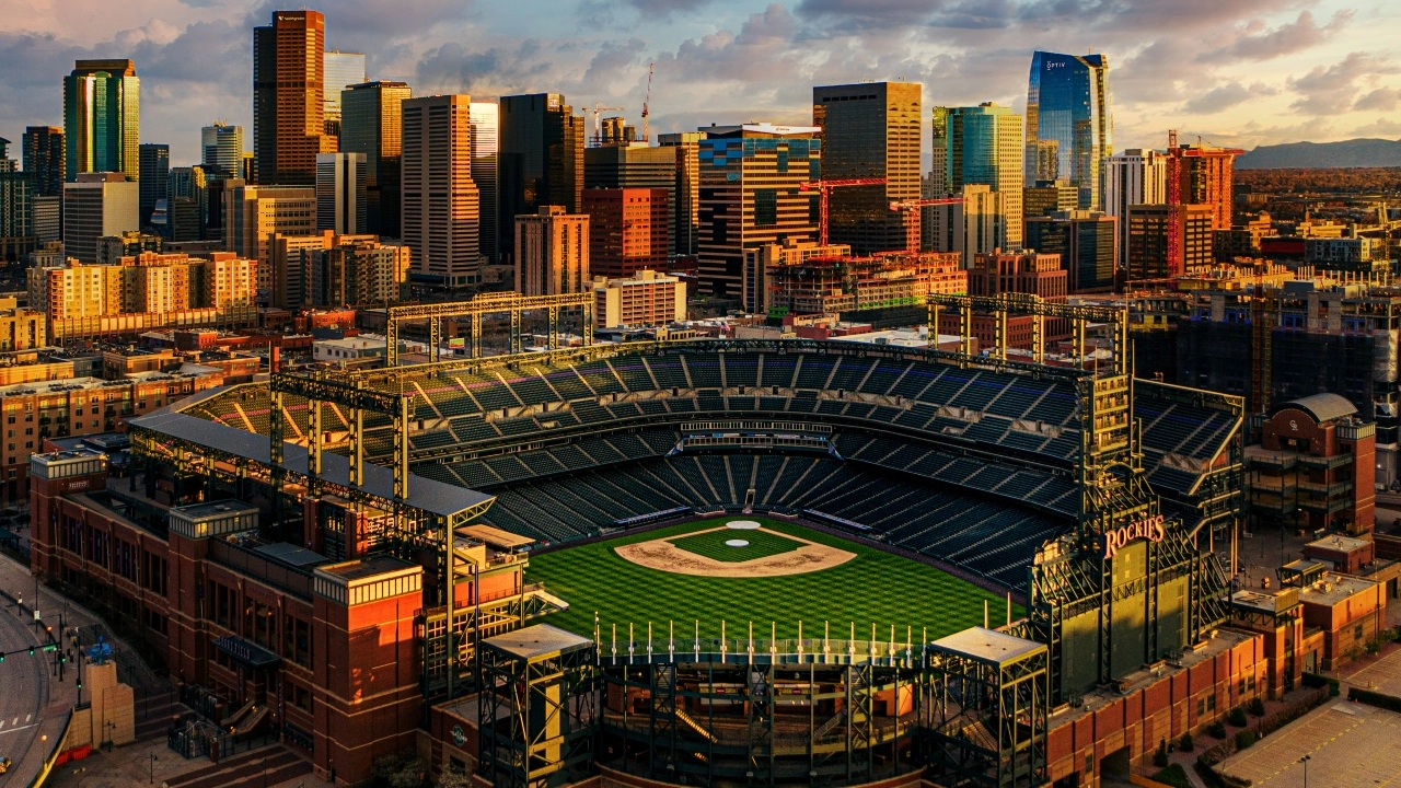 Image of Colorado Rockies' baseball stadium with downtown Denver skyline in background