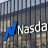 Image of Nasdaq signage on the side of a glass buidling