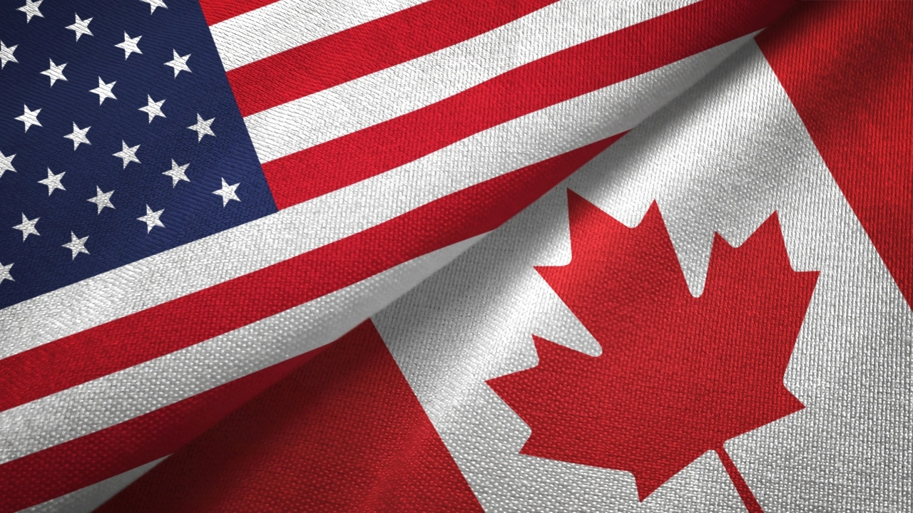 Image of U.S. and Canadian flags next to each other