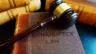 Image of a gavel sitting amid bankruptcy law books