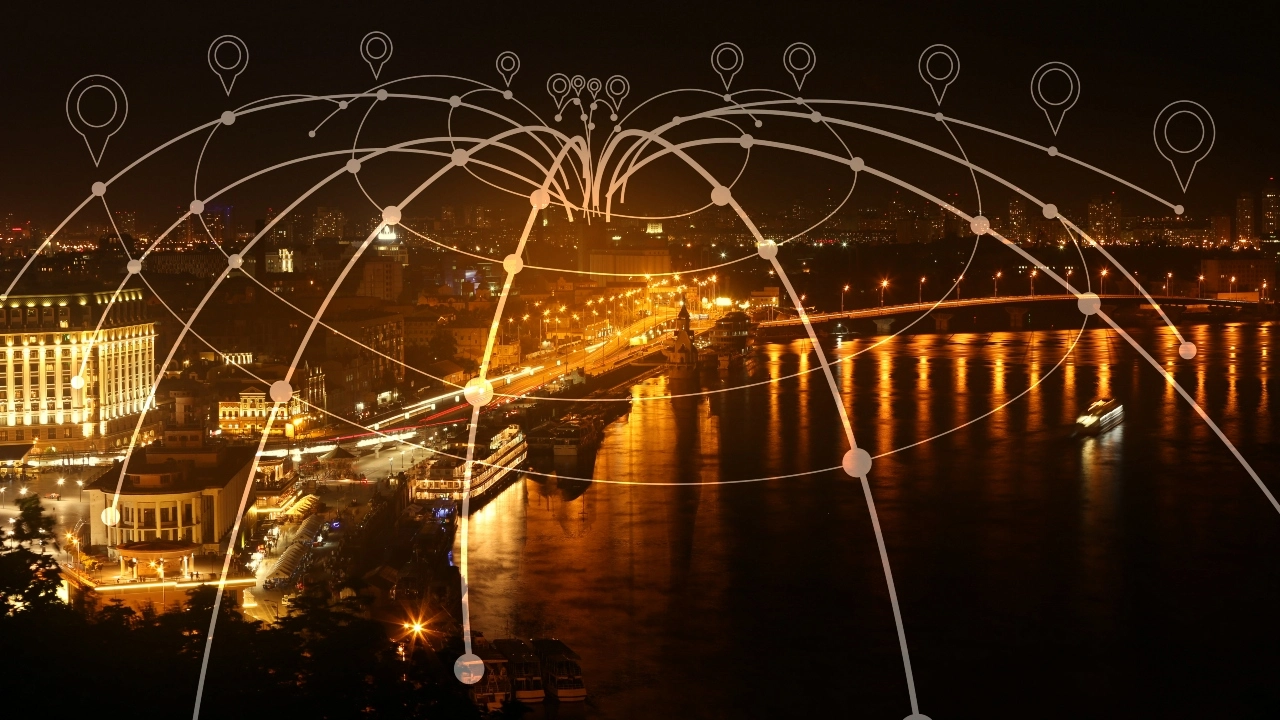 Image of a generic city at night with location pointers and meridian lines