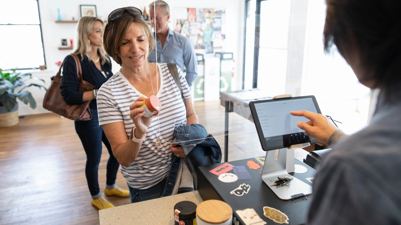 Image of a customer making a purchase at a cannabis retailer.