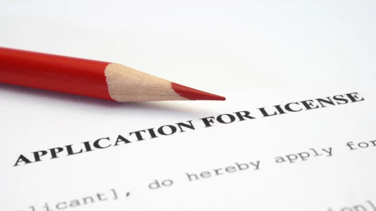 Image of a pencil sitting atop a license application