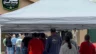 Image of customers standing in line to enter the Great Smoky Cannabis Co. on opening day, 4/20, 2024