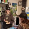 Image of a budtender talking with a customer at POPS Port Orford in Oregon
