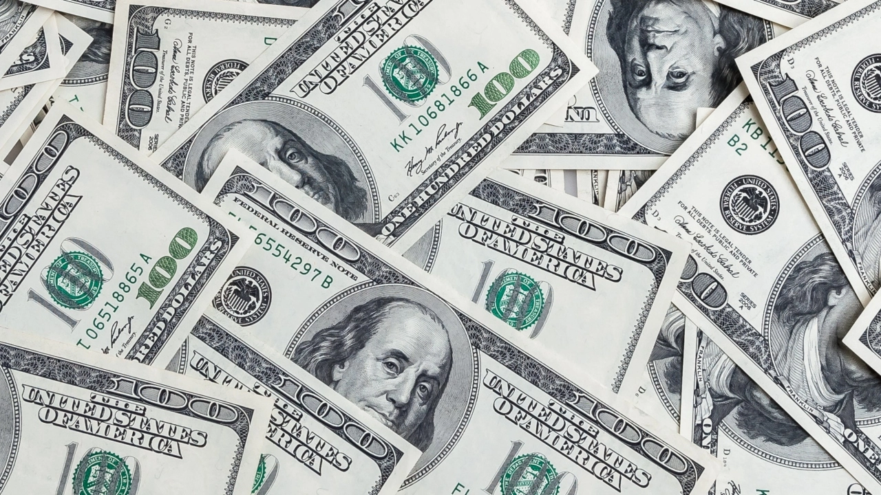 Image of a pile of $100 bills