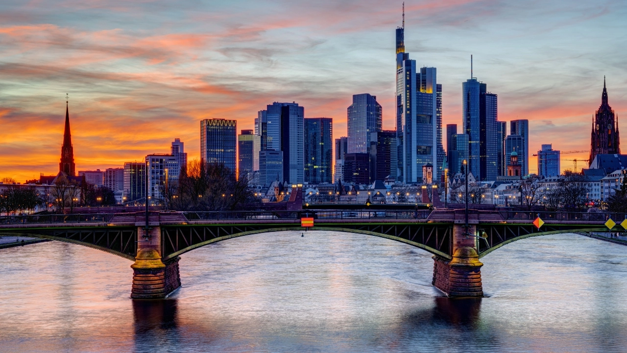 Image of a sunset over downtown Frankfurt, Germany, and the Main River
