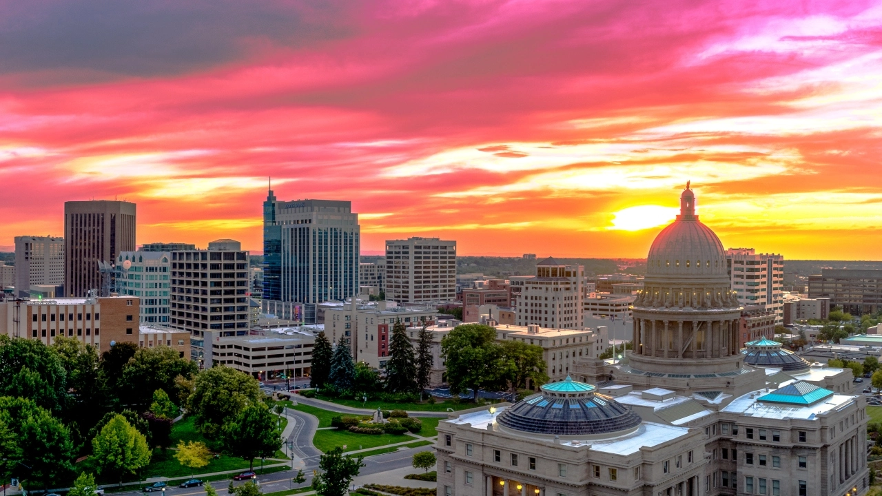 Image of downtown Boise, Idaho, including the state capitol building, at sunset