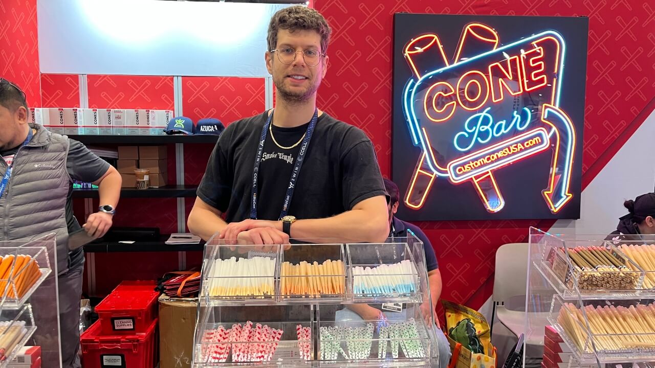 Image of Harrison Bard at the Custom Cones booth at MJBizCon