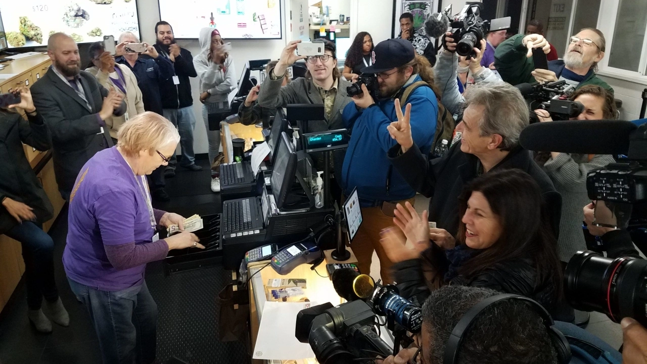 Image of a customer making the first adult-use marijuana purchase at Berkeley Patients Group