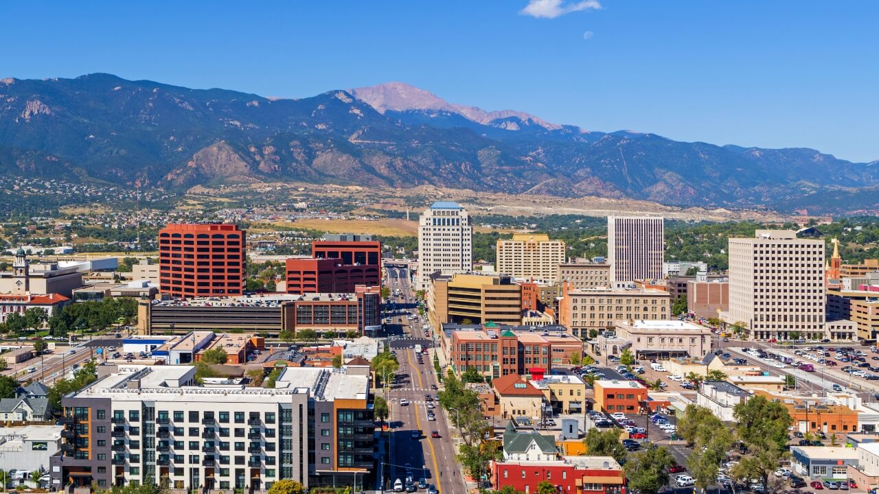 Aerial image of downtown Colorado Springs with Pikes Peak in the background