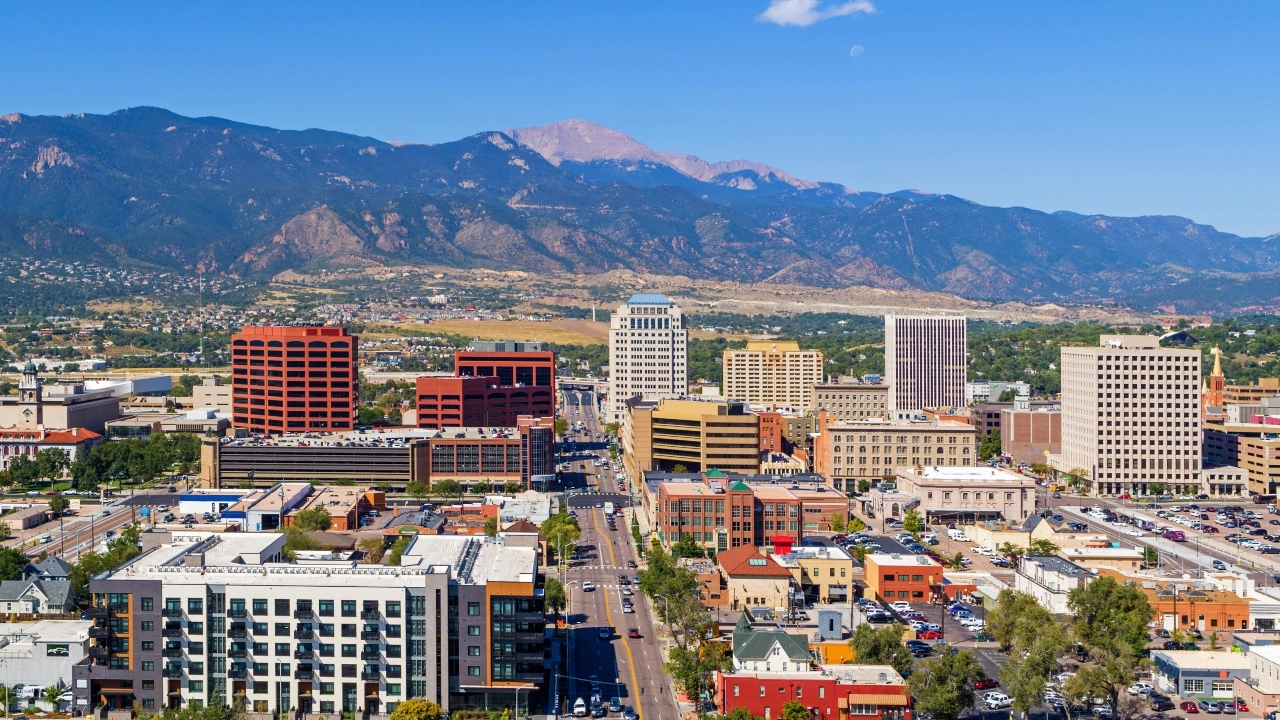 Aerial image of downtown Colorado Springs with Pikes Peak in the background