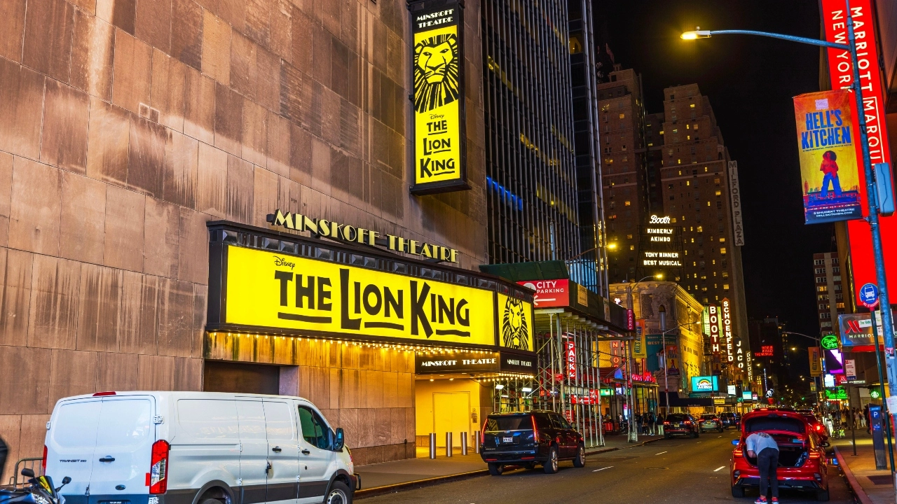Image of the Minskoff Theatre displaying a "Lion King" marquee in the Broadway theater district in New York