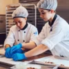 Image of employees arranging infused chocolates before packaging