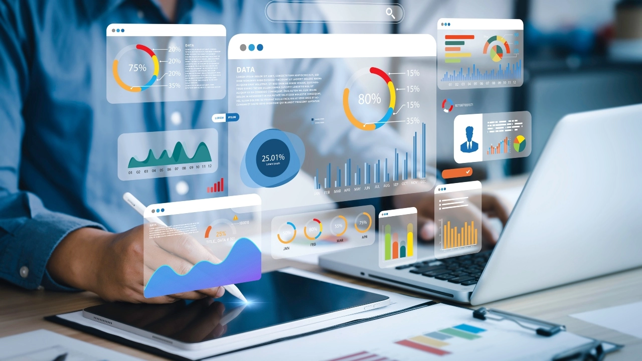 Image of an analyst using a computer and dashboard for business analysis